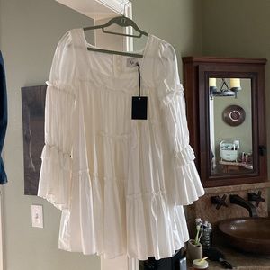 White/off white Aje dress size 8. Would consider it a baby doll dress.